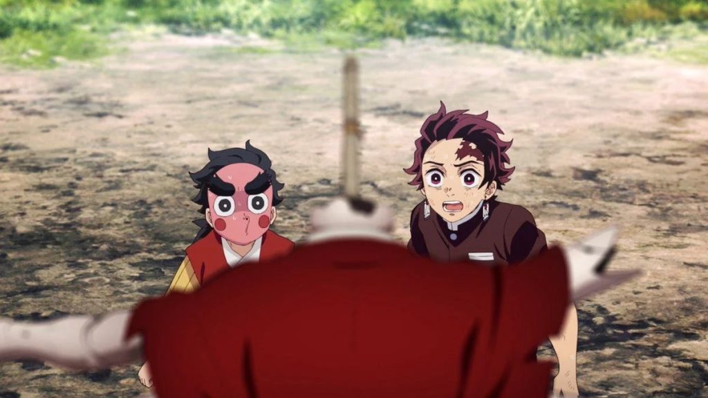 'Demon Slayer: Kimetsu no Yaiba – Swordsmith Village Arc' Ep. 2 "Yoriichi Type Zero" screenshot depicting Kotetsu and Tanjiro staring in shock at the broken dummy with a sword sticking out of it.