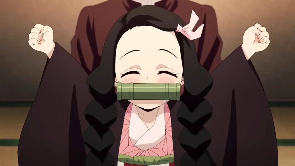 'Demon Slayer: Kimetsu no Yaiba – Swordsmith Village Arc' Ep. 3 "A Sword from Over 300 Years Ago" screenshot depicting Chibi Nezuko cheering after Tanjiro has finished braiding her hair.