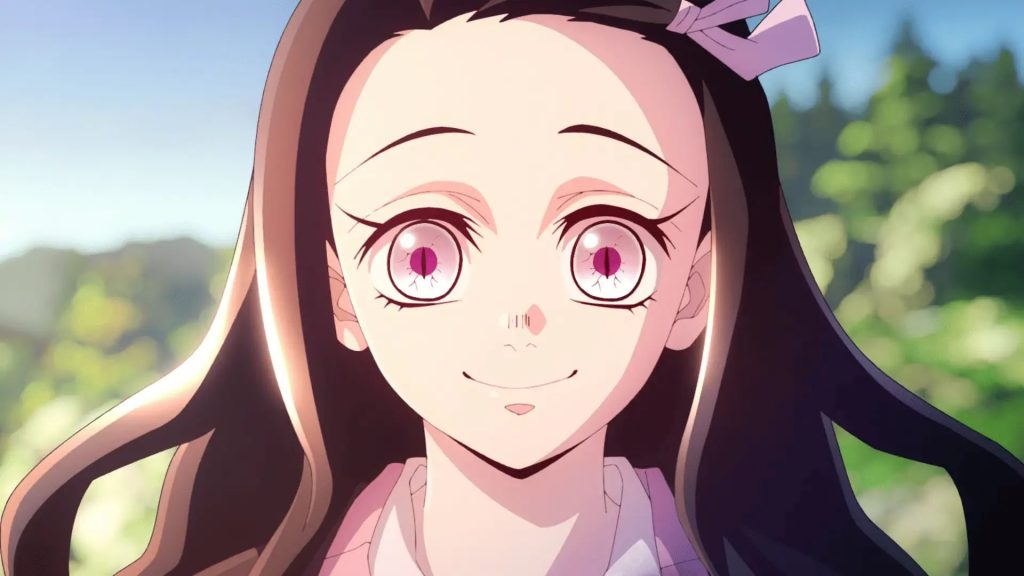Demon Slayer: Kimetsu no Yaiba – Swordsmith Village Arc Ep. 11 "A Connected Bond: Daybreak and First Light" screenshot depicting Nezuko standing in the sun and smiling brightly with no gag in sight.