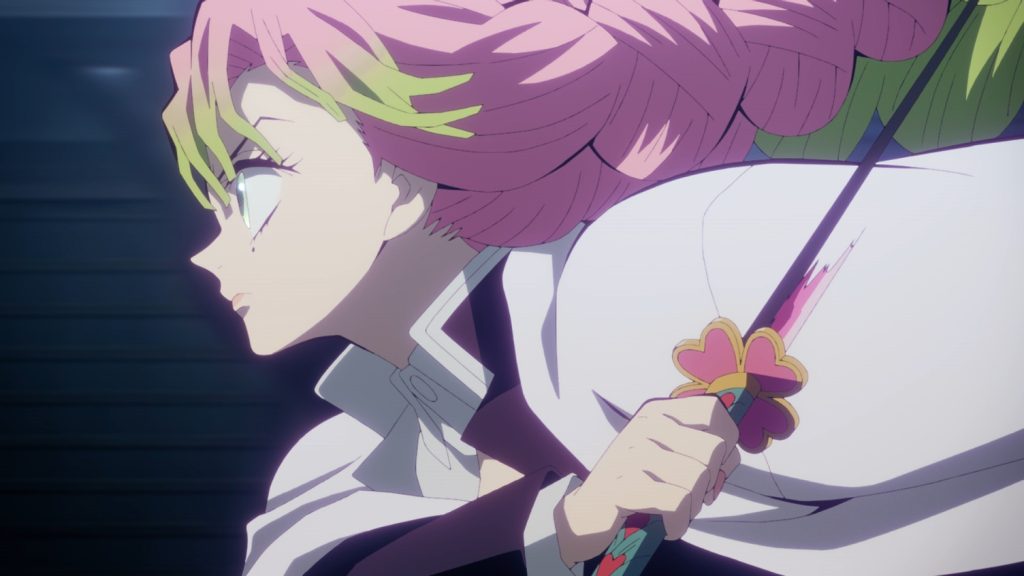 Demon Slayer: Kimetsu No Yaiba – Swordsmith Village Arc Ep. 10 "Love Hashira Mitsuri Kanroji" screenshot depicting Mitsuri in the middle of swinging her urumi sword.