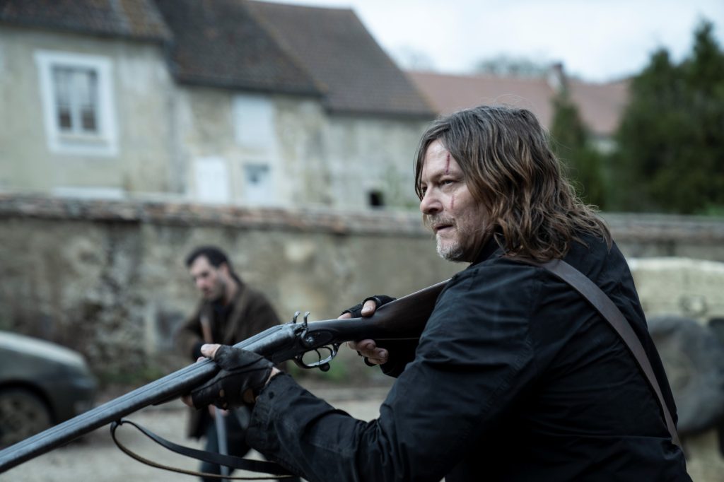 Daryl (Norman Reedus) points a shotgun in The Walking Dead: Daryl Dixon - The Book of Carol