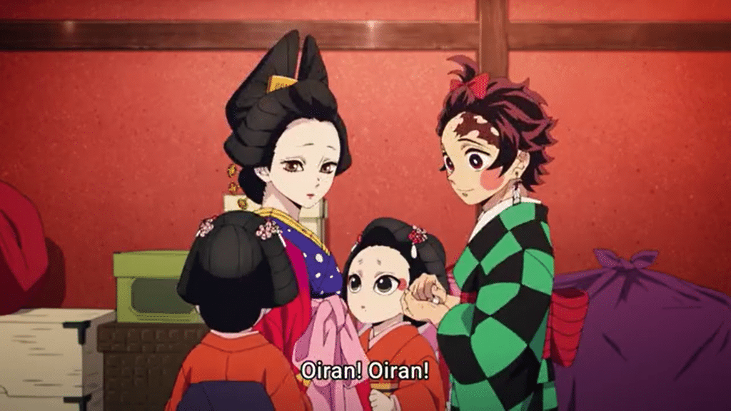 "Demon Slayer: Entertainment District Arc" screenshot showing Sumiko sans makeup next to Koinatsu and 2 of her young attendants.