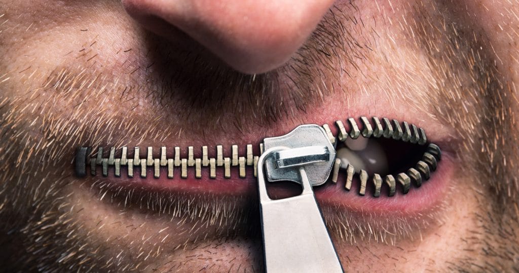 A partially zipped mouth, ripe for unzipping.