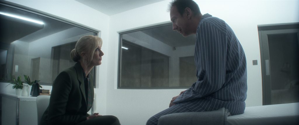 The Sandman. (L to R) Joely Richardson as Ethel Cripps, David Thewlis as John Dee in episode 103 of The Sandman. Cr. Courtesy of Netflix © 2022